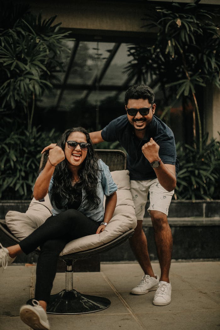 Man and Woman on a Terrace Expressing Excitement
